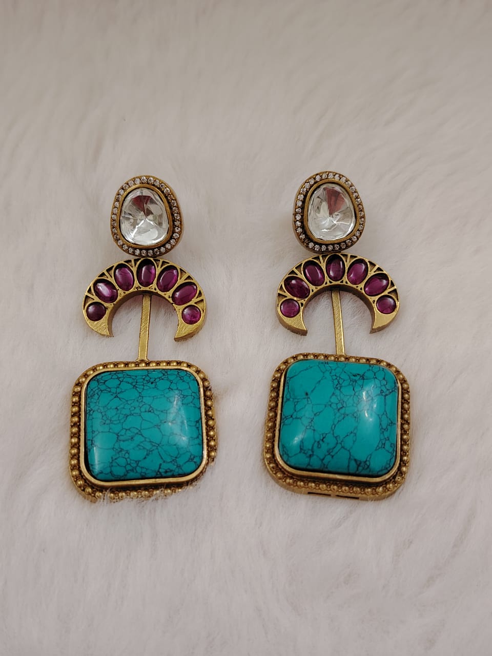 Sabyasaachi inspired kundan danglers with turquoise doublet and kemp stones