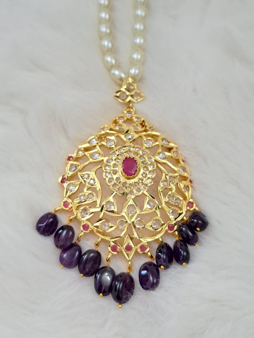 HYDERABADI JADAU PEARL SET WITH AMETHYST AND RUBY PAIRED WITH TEARDROP DANGLERS
