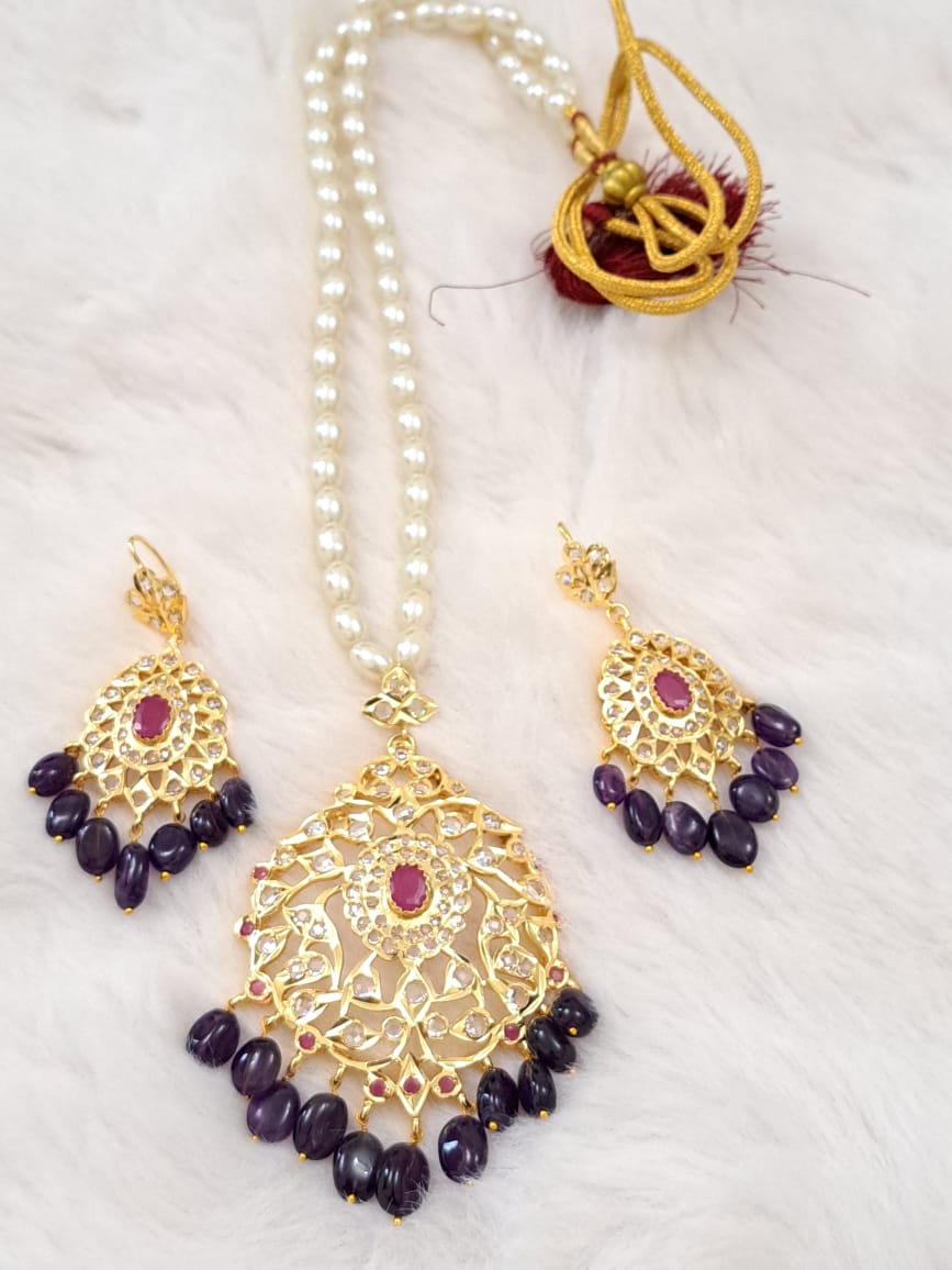 HYDERABADI JADAU PEARL SET WITH AMETHYST AND RUBY PAIRED WITH TEARDROP DANGLERS